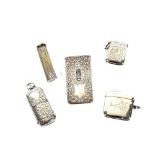 A silver sovereign case/Vesta; three various silver Vesta cases and a plated Dunhill lighter, (5)