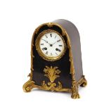 A 19th Century ebonised and ormolu mounted mantel clock, 8 day movement striking on a gong, circular