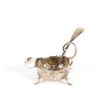 A late Victorian silver cream jug, of small size with foliate embossed decoration and flying C