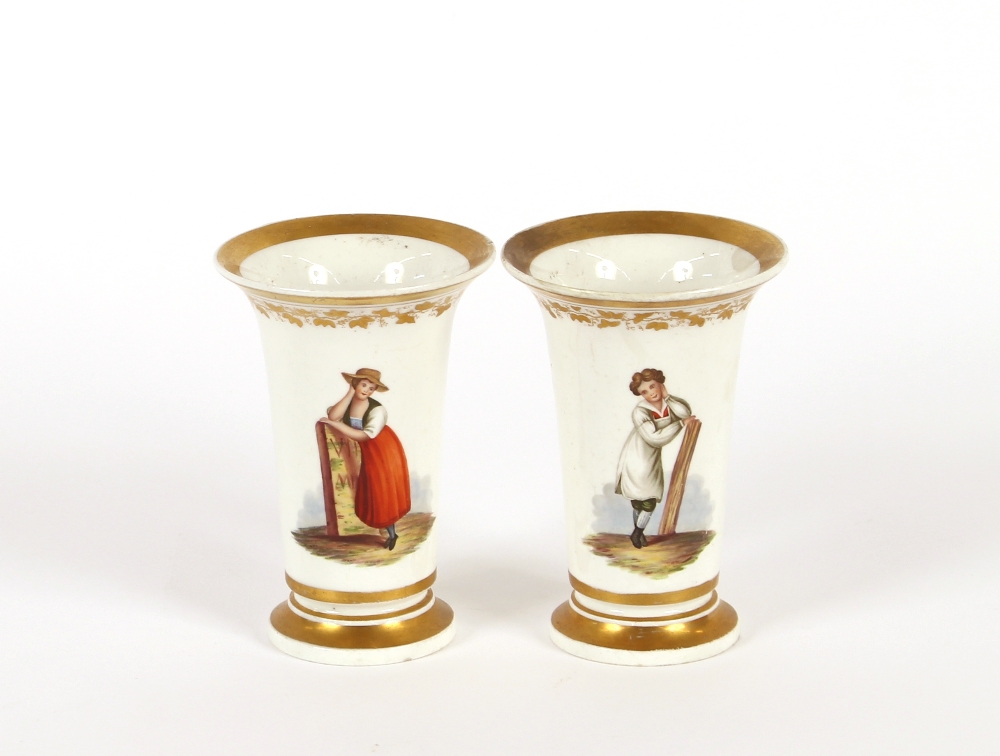 A pair of Bloor Derby porcelain spill vases, decorated with rural figures heightened in gilt, 12cm