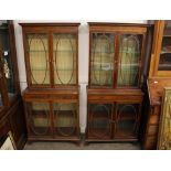 A near pair of Edwardian mahogany and satinwood cross-banded china display cabinets, in two