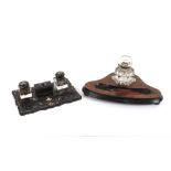 A Victorian walnut and ebonised desk stand, with block glass inkwell; and a papier mache and