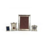 A rectangular silver mounted photograph frame; a small Art Nouveau design silver frame and two