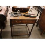 An Antique oak side table, fitted single drawer, raised on turned supports, 70cm wide