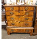 An 18th Century walnut and cross-banded chest, on stand, fitted two short and three long drawers