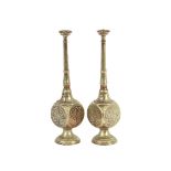 A pair of Persian white metal rose water sprinklers, with elongated necks and square bodies,