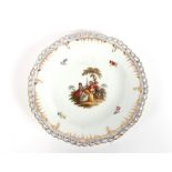 A 19th Century Berlin porcelain part dessert set, comprising 12 pierced border plates, and three