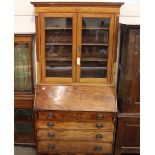 A George III mahogany and boxwood strung bureau bookcase, the associated glazed top fitted