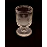 A heavy etched glass goblet, decorated with a balustraded garden and central urn, 15cm