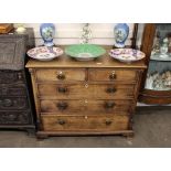 A 19th Century oak chest, fitted two short and three long graduated drawers, raised on bracket feet