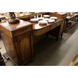 A Victorian mahogany pedestal sideboard, fitted with a long central drawer flanked by cupboards