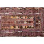 An Eastern prayer rug, having stylised multi borders, 115cm x 75cm