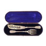 A pair of Victorian silver Fiddle pattern fish servers, having foliate engraved decoration, cased