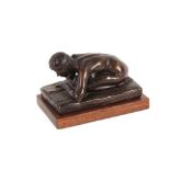 Doubleday, bronze study of a kneeling nude female reading a book, numbered 4/9, 17cm long, raised on