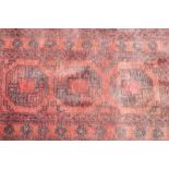 An Eastern rug, having central gul decoration on an ochre ground, 145cm x 76cm