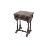 A Victorian carved oak work table, the hinged lid opening to reveal a partitioned interior, all over