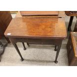 A George III mahogany tea table, the rectangular foldover top raised on rounded tapering legs and