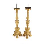 A pair of Venetian giltwood candlesticks, in the 17th Century style, with metal prickets, floral and