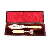 A pair of foliate engraved plated fish servers, having ivory handles, in original silk lined case;