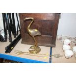 A brass ornament and candle snuffer and toasting f