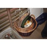 A wicker log basket and contents