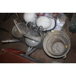 Two galvanized watering cans and two galvanized pa