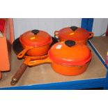 A quantity of Le Creuset cooking dishes