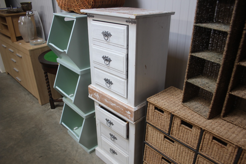 A pair of white painted pine three drawer bedside