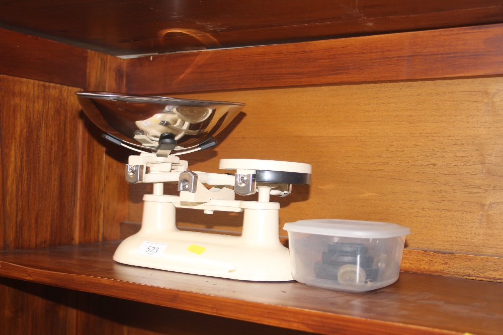 A set of kitchen scales and weights