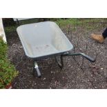 A galvanized wheelbarrow