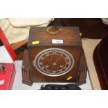 An Art Deco oak cased mantle clock