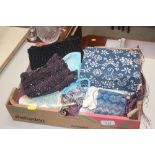 A box containing various purses; bags etc