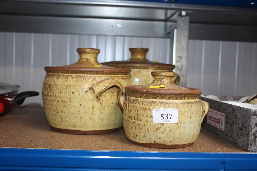 Three pottery tureens and covers