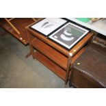 A teak three tier tea trolley