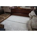 A large mahogany sleigh bed