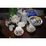 A quantity of various teaware; dog ornaments; deco