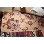 An approx. 3' x 2'6" floral patterned wood rug