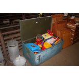A metal storage trunk and contents; various toys
