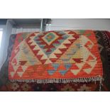 An approx 1'10" x 1'8" vegetable dye Chobi Kelim rug