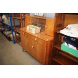 A 1970's light oak veneered sideboard