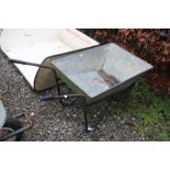 A galvanized wheelbarrow