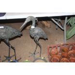 A metal garden ornament in the form of a Heron