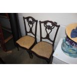 A pair of Victorian style mahogany nursing chairs