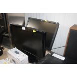 An Alba monitor together with an HP monitor