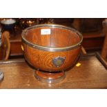 An oak and silver plate mounted pedestal bowl