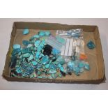 A tray of turquoise stones