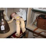 An Armand Marseille bisque headed doll