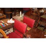 Two red leather and upholstered dining chairs and