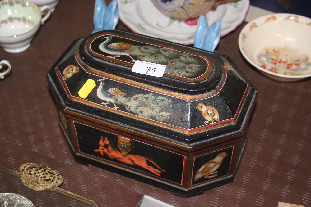 A painted and decorated wooden trinket box depicti