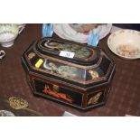 A painted and decorated wooden trinket box depicti